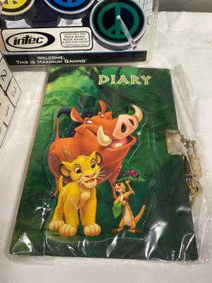 Miscellaneous toys, including vintage puzzle, diary, drum pads