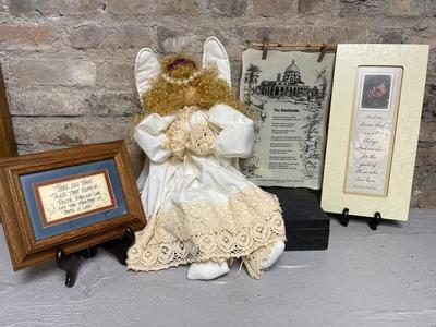 Sale Photo Thumbnail #298: Religious-themed pictures and wall hangings, andel shelf sitter with beautiful crochet edged gown (she does have a broken neck but it would be easily repaired), planter/vase, Christmas basket, clown figurine, and succulent decor