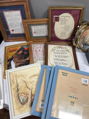 Wall decor and frames in a blue tote with lid