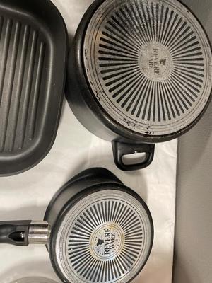 Two revere wear pots and pampered chef griddle pan with cookie cutters