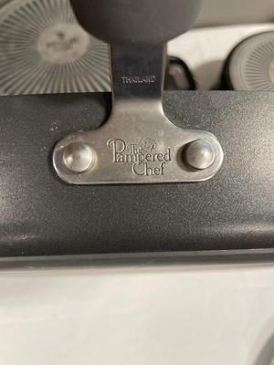 Two revere wear pots and pampered chef griddle pan with cookie cutters