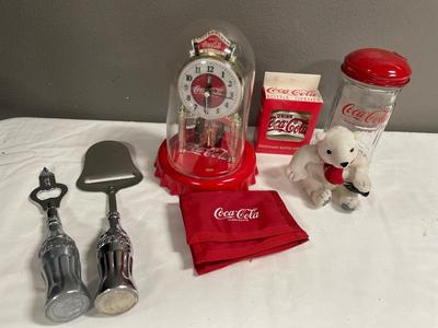 Coca-Cola bottle openers, salt, port, wallet, and clock