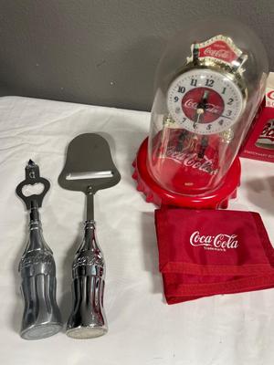Coca-Cola bottle openers, salt, port, wallet, and clock