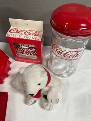 Coca-Cola bottle openers, salt, port, wallet, and clock