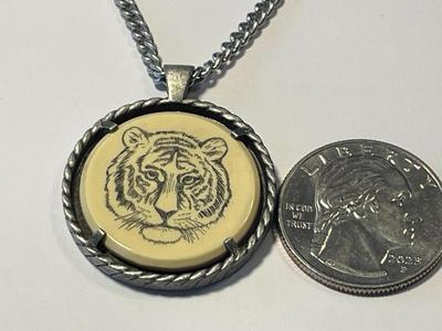 Vintage Avon Bengal Tiger Necklace Etched Scrimshaw Pendant 1979 on a Silver-tone 20" Chain in Good Preowned Condition.