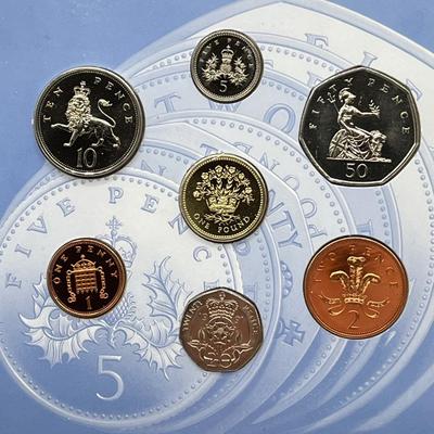 LOT 169J: Five United Kingdom Brilliant Uncirculated Coin Sets - 1984, 1986, 1989-'91