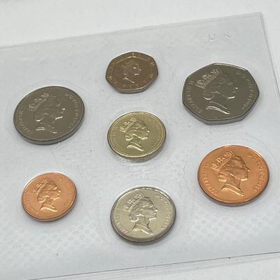 LOT 169J: Five United Kingdom Brilliant Uncirculated Coin Sets - 1984, 1986, 1989-'91