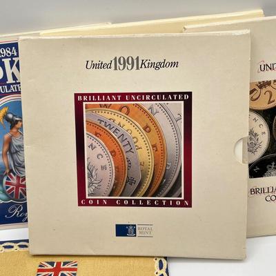 LOT 169J: Five United Kingdom Brilliant Uncirculated Coin Sets - 1984, 1986, 1989-'91