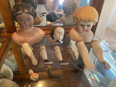 ANTIQUE DOLL HEADS AND LIMBS