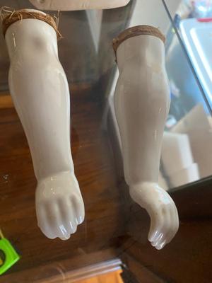 ANTIQUE DOLL HEADS AND LIMBS