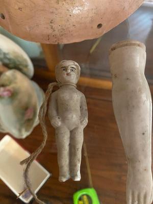 ANTIQUE DOLL HEADS AND LIMBS