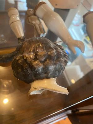 ANTIQUE DOLL HEADS AND LIMBS