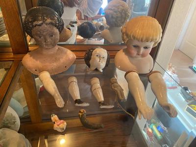 ANTIQUE DOLL HEADS AND LIMBS