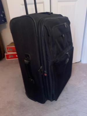 DELSEY SUITCASE AND NEAT CARRY ON THAT DOUBLES AS A BRIEFCASE