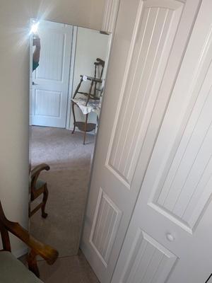 CAPTAINS CHAIR AND BEVELED MIRROR