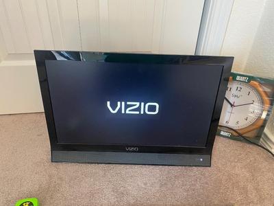 VIZIO 25” TELEVISION AND WALL CLOCK