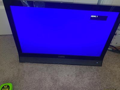 VIZIO 25” TELEVISION AND WALL CLOCK