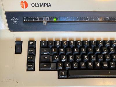 OLYMPIA TYPEWRITER AND TYPEWRITER TABLE