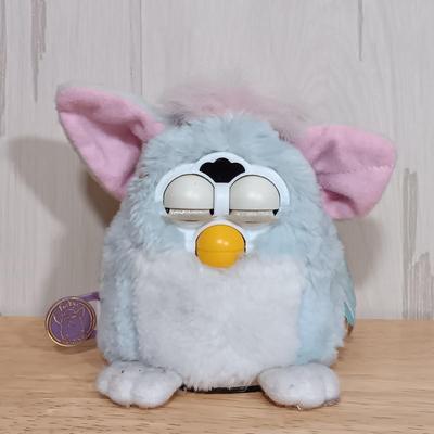 LOT 22: Vintage Tiger Furby's 1999 Striped, 1998 Giraffe and 1999 Furby Baby w/ Furby Trainer's Guide Book