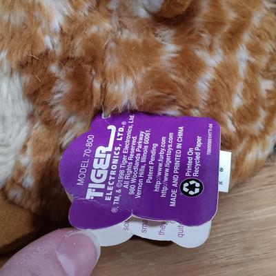 LOT 22: Vintage Tiger Furby's 1999 Striped, 1998 Giraffe and 1999 Furby Baby w/ Furby Trainer's Guide Book