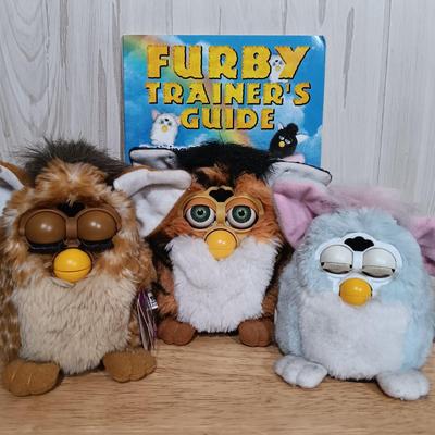 LOT 22: Vintage Tiger Furby's 1999 Striped, 1998 Giraffe and 1999 Furby Baby w/ Furby Trainer's Guide Book