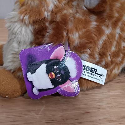LOT 22: Vintage Tiger Furby's 1999 Striped, 1998 Giraffe and 1999 Furby Baby w/ Furby Trainer's Guide Book