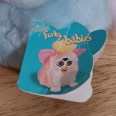 LOT 22: Vintage Tiger Furby's 1999 Striped, 1998 Giraffe and 1999 Furby Baby w/ Furby Trainer's Guide Book