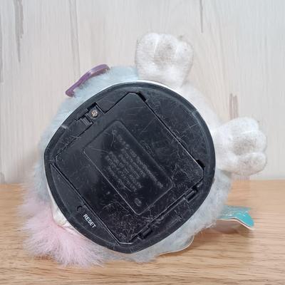 LOT 22: Vintage Tiger Furby's 1999 Striped, 1998 Giraffe and 1999 Furby Baby w/ Furby Trainer's Guide Book