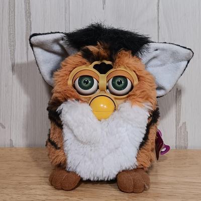LOT 22: Vintage Tiger Furby's 1999 Striped, 1998 Giraffe and 1999 Furby Baby w/ Furby Trainer's Guide Book