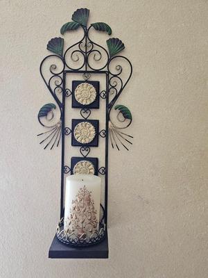 Decorative metal pillar candle holder with candle