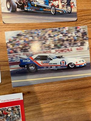 NHRA’S JOHN FORCE AUTOGRAPHED CARD ALONG WITH OTHERS AND AUTOMOBILE BOOKS