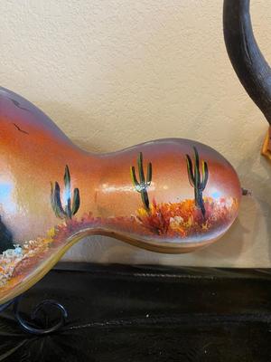 PAINTED GOURD AND MOUNTED HORNS