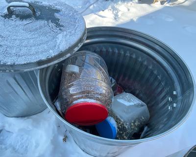 Can and bird feed in plastic containers