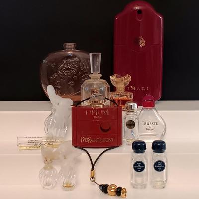 LOT 275: Vintage Yvs St Laurent Opium Perfume with Nina Ricci L'air Du Temps Empty Bottles, Trueste by Tiffany Bottle, Nueva Maja...