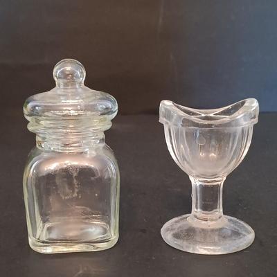 LOT 277: Vintage Estée Lauder Azurée Green Jars and Re-Nutriv Jars, Glass Eye Cup, Apothecary Jar, Vintage Hand Bag & More