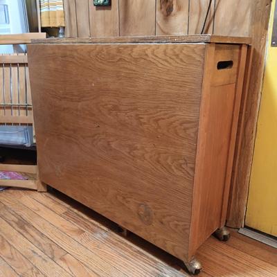 LOT 286: Romanian Made MCM Hideaway Drop Leaf Table w/ 5 Folding Chairs