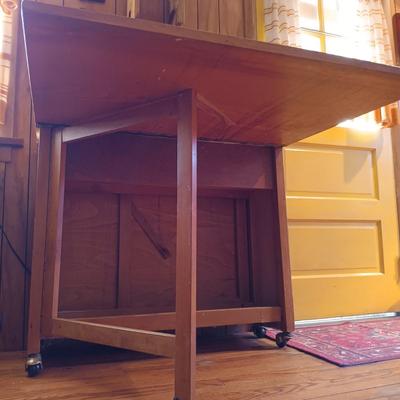 LOT 286: Romanian Made MCM Hideaway Drop Leaf Table w/ 5 Folding Chairs