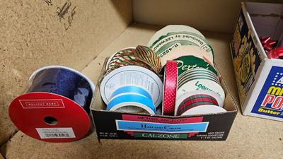 A bunch of Holiday ribbon and wrapping paper and ribbon