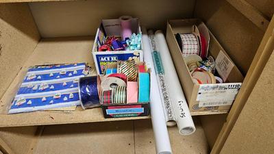 A bunch of Holiday ribbon and wrapping paper and ribbon