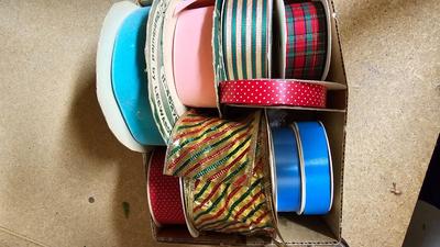 A bunch of Holiday ribbon and wrapping paper and ribbon
