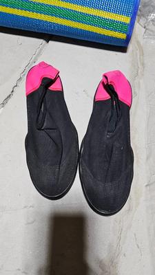 Folding beach rug, water floaties, and water shoes