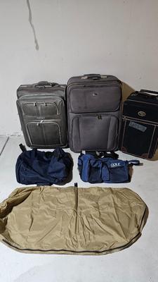 Luggage / Suitcases and two duffel bags