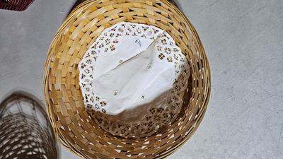 Variety of wicker baskets with doilies