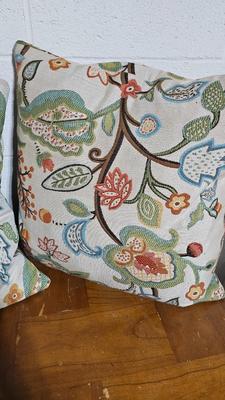 Wrought Iron basket with candles and two throw pillows