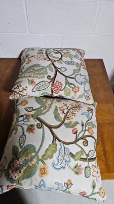 Wrought Iron basket with candles and two throw pillows