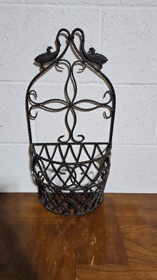 Wrought Iron basket with candles and two throw pillows