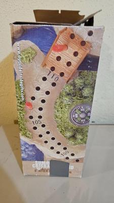 Cool Summit trail cribbage board and an assortment of playing cards and travel games