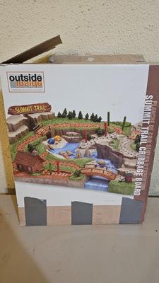 Cool Summit trail cribbage board and an assortment of playing cards and travel games