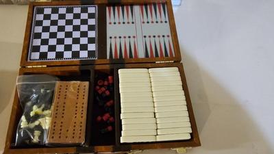 Cool Summit trail cribbage board and an assortment of playing cards and travel games