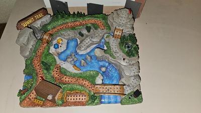 Cool Summit trail cribbage board and an assortment of playing cards and travel games